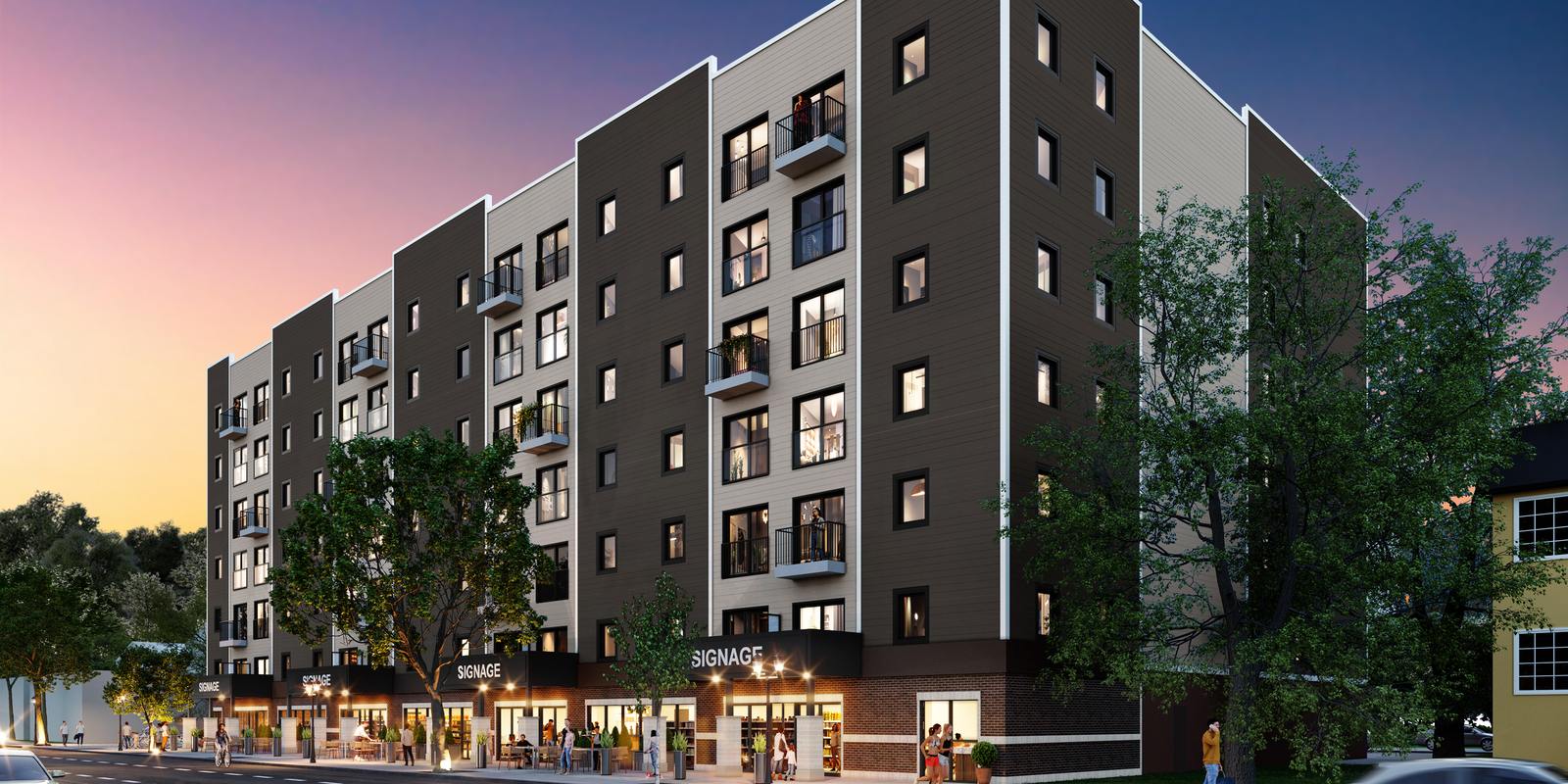 The corner of 130 Sherbrook Residences at dusk, with patio seating and bike parking in front of the storefronts